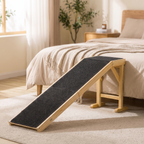 Solid wood dog ramp beside a bed