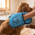 Hands in the towel's built-in pockets drying a pet